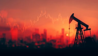 Silhouette of oil pump jack against a cityscape during sunset with falling stock graph